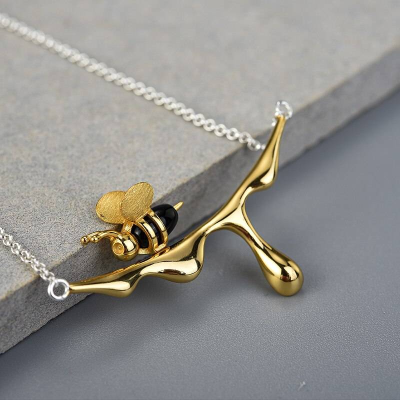 Dripping Honey Pendant Necklace closeup of bee