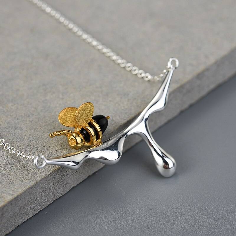 Dripping Honey Pendant Necklace closeup of silver bee
