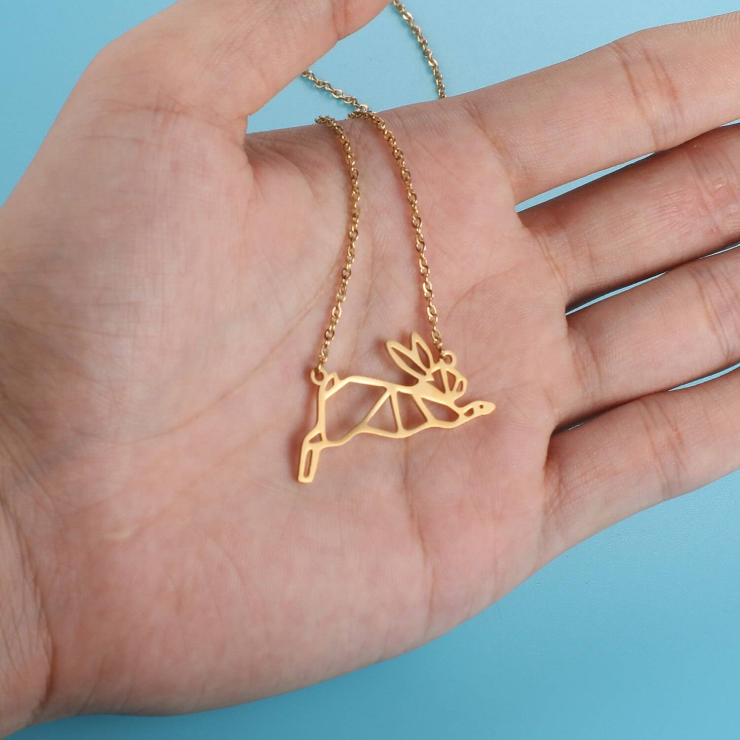 Leaping Hare Origami Necklace in hand