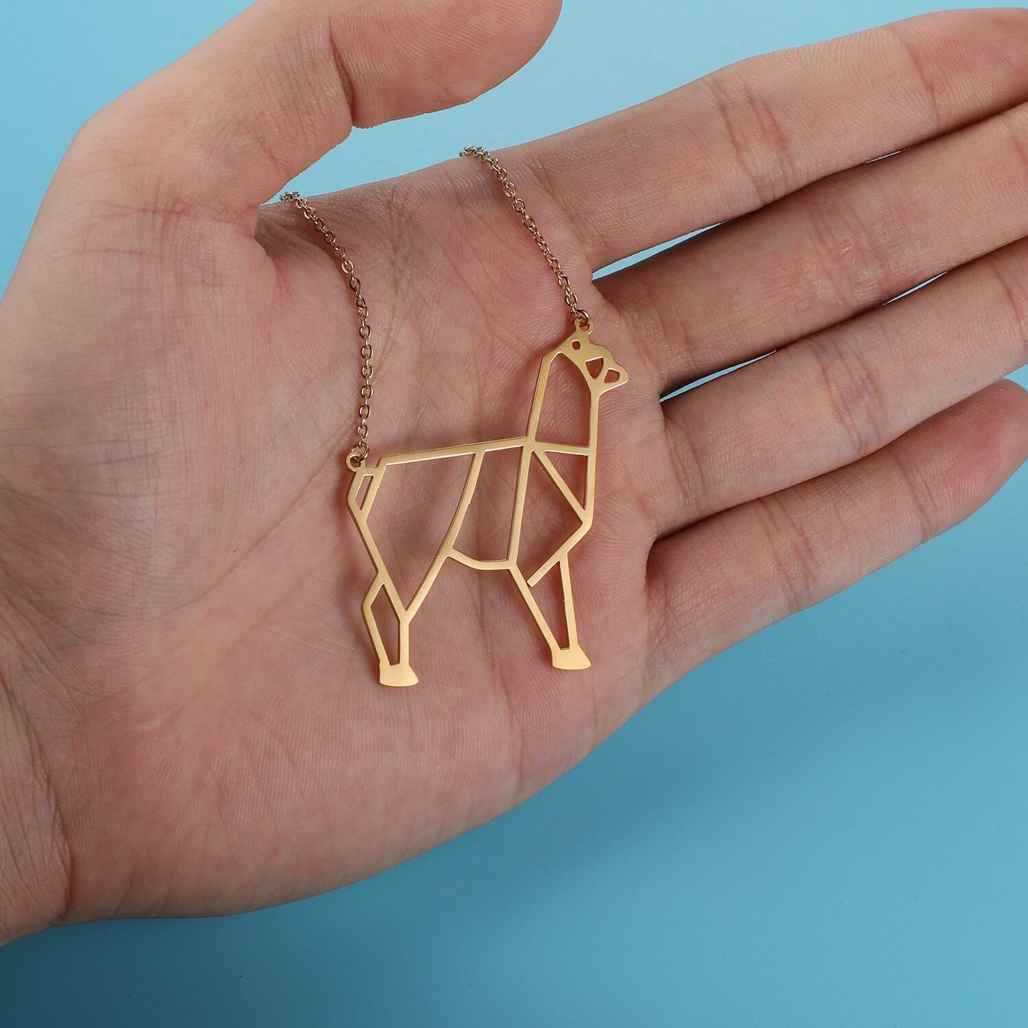 Gentle Alpaca Origami Necklace in hand
