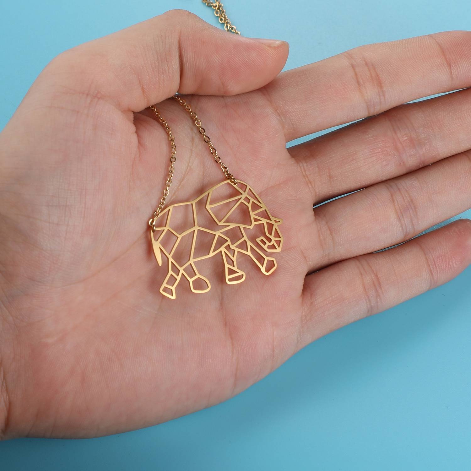 Majestic Elephant Origami Necklace in hand