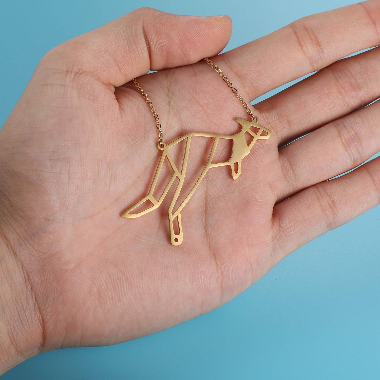 Energetic Kangaroo Origami Necklace in hand